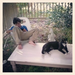 The table before with kid and cat on it